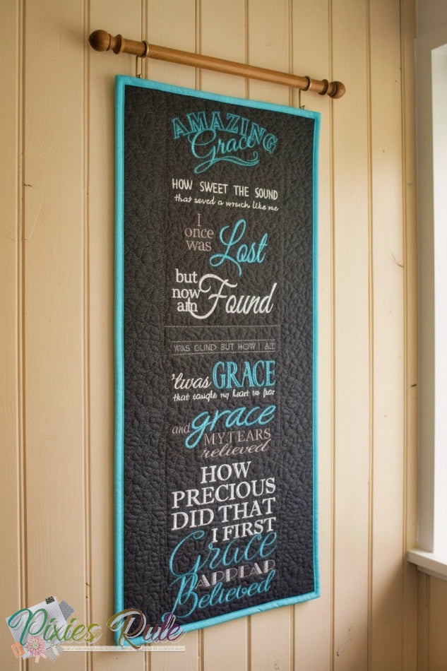 Decorative wall hanging with text on a wooden panelled wall.