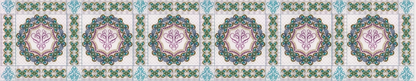 Decorative bed runner with floral patterns in green, pink, and blue on a white background