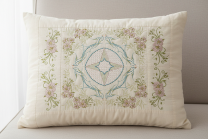 Decorative pillow with floral embroidery on a neutral background