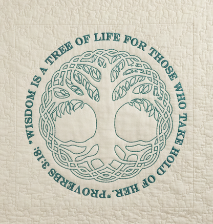 Textile with a tree of life design and text on a white background
